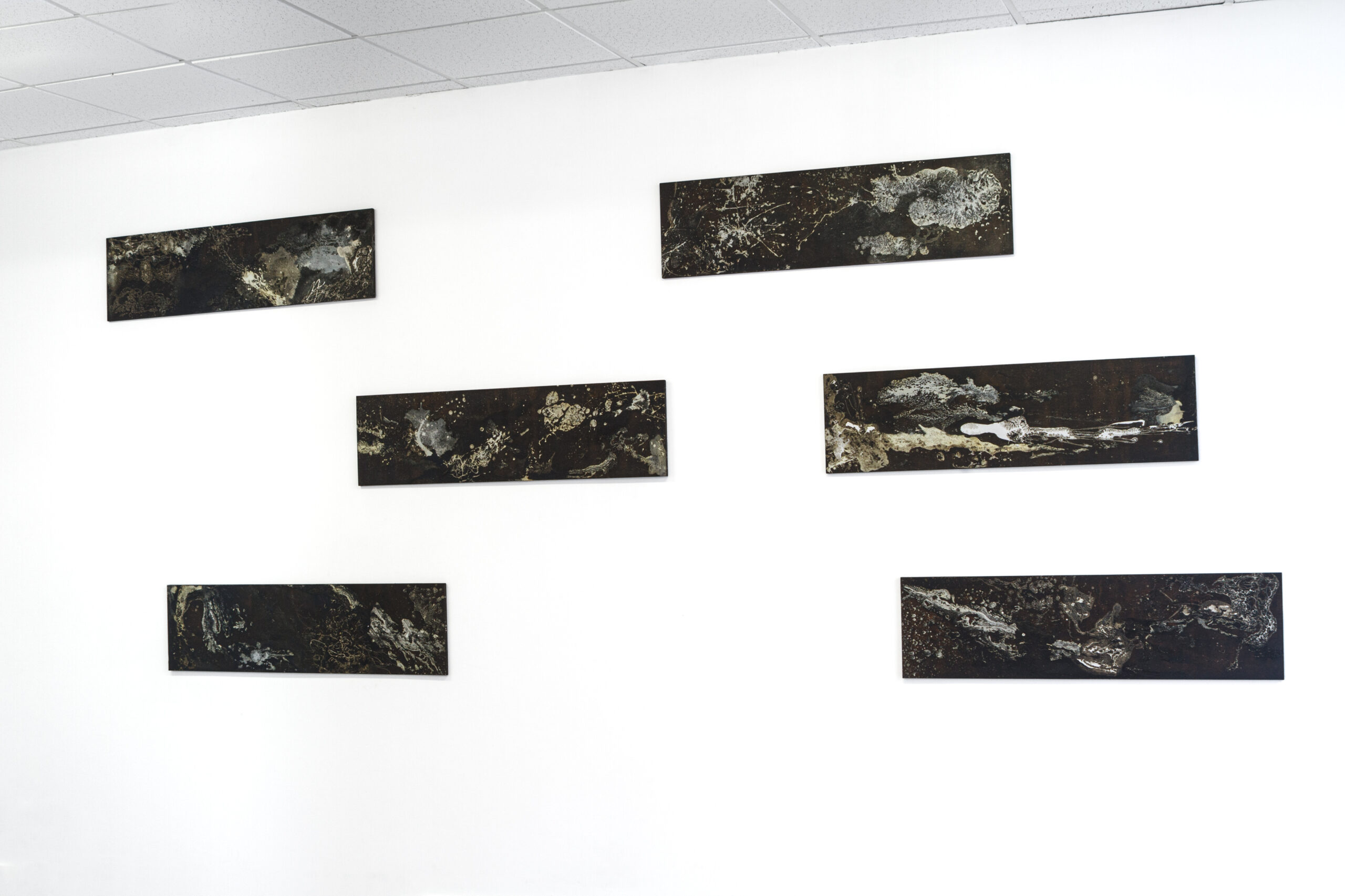 Universes in Universes, series of 6 pieces, 110 cm x 30 cm, breast milk, motor oil, and mixed media on plywood panel, 2019.