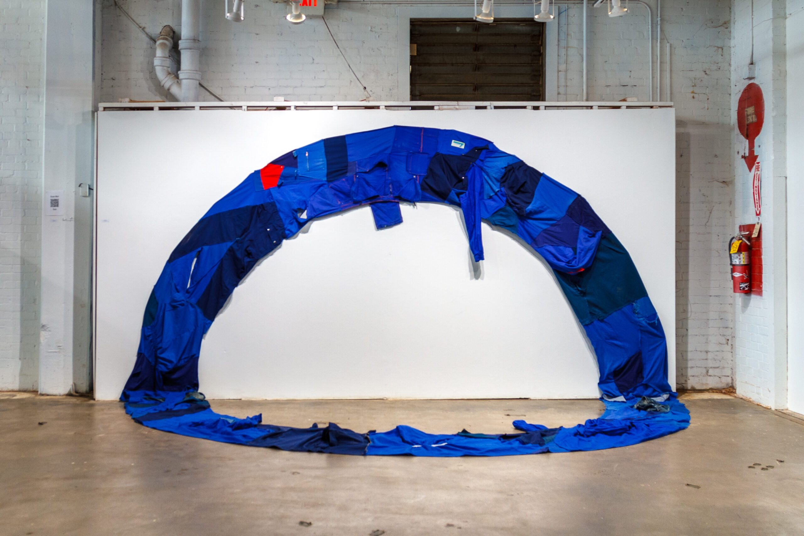 Great Circle, 186" diameter surface, 20" thick ring, Sewn used workwear textiles, 2024.