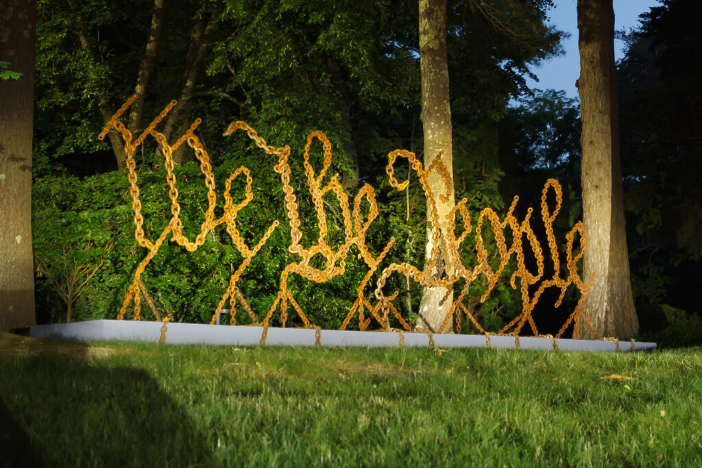 We the People, 2026. Outdoor public art commission produced for Under Construction: America at 250, Art Complex Museum, Welded steel chain, 2l' x 6' x 2.